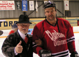 Don Cherry assisted off the ice surface